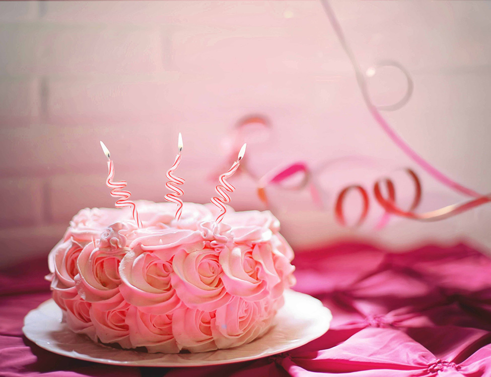 Pink rose birthday cake with candles